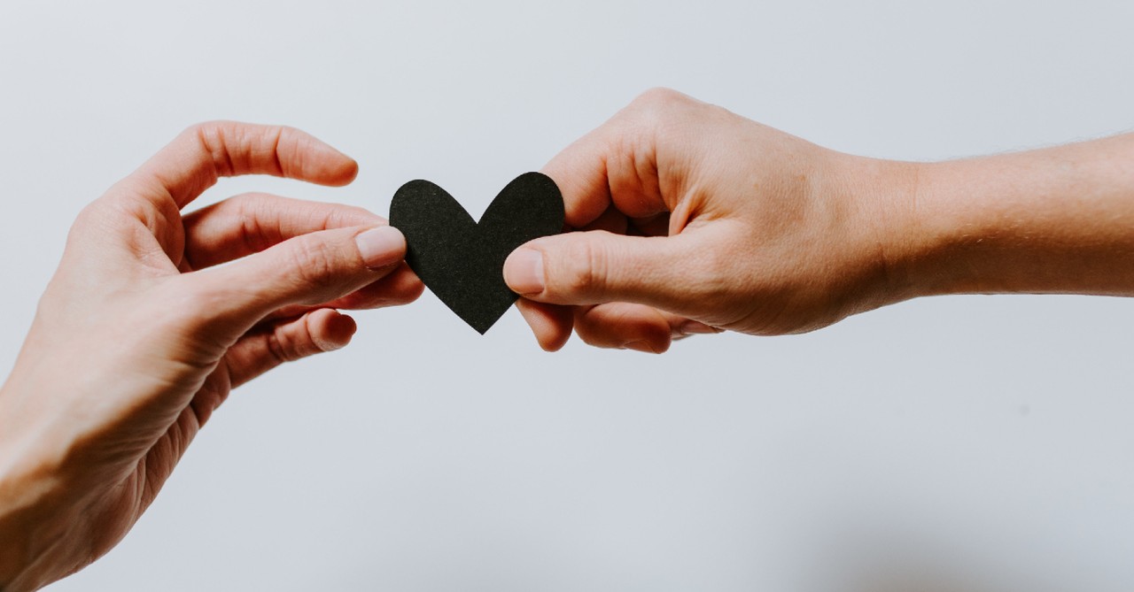 reaching out holding a heart