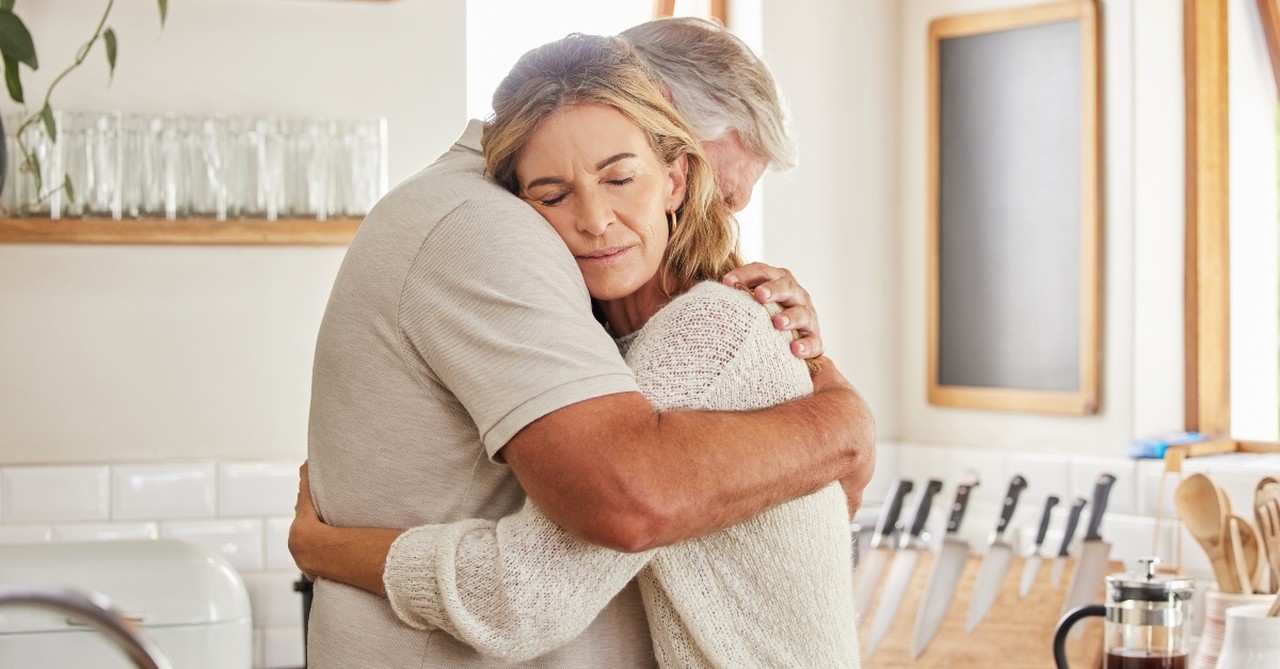Husband and wife hugging