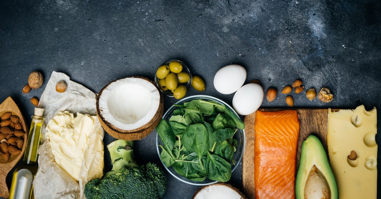 Healthy foods. Greens, carrots, coconut, salmon