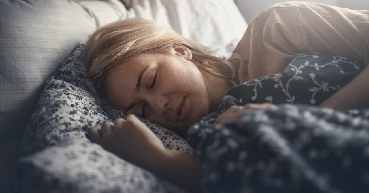 woman laying in bed dream sleep