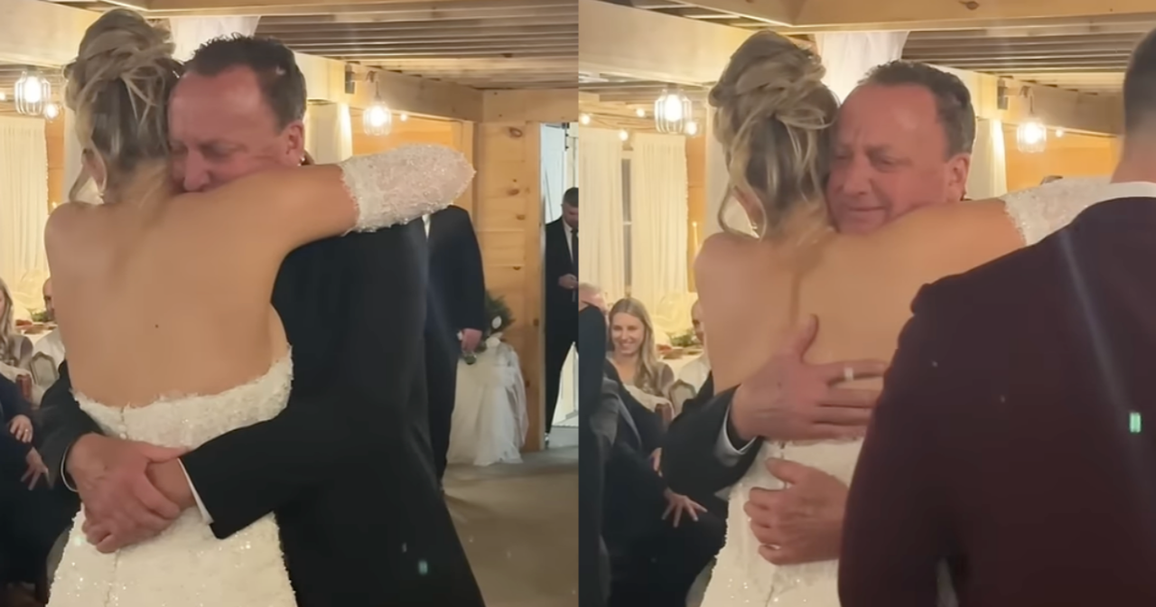 a bride in a wedding gown hugging her father